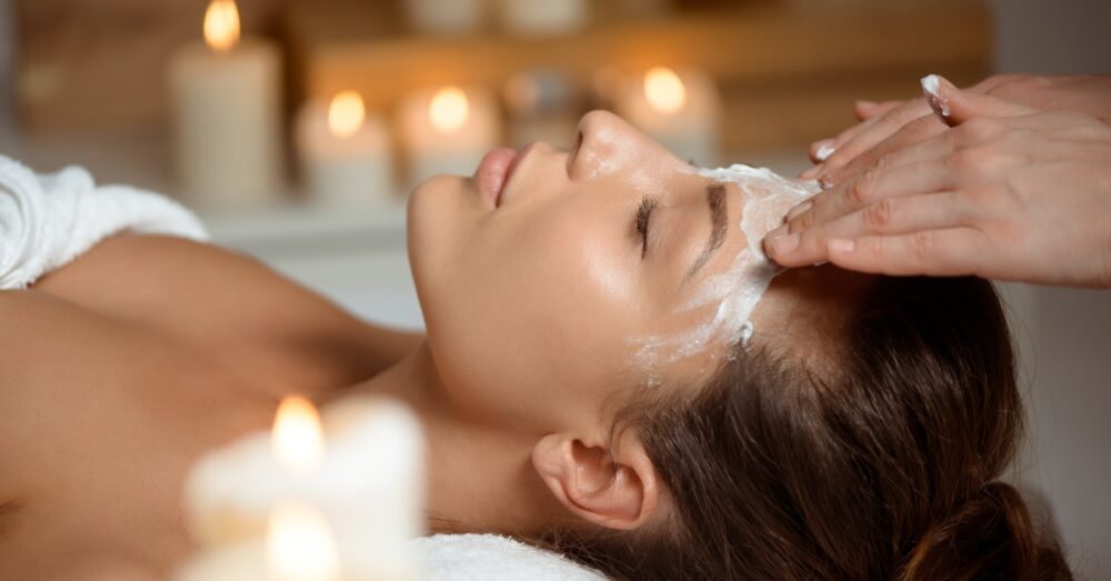 Woman receiving a facial in a relaxing environment