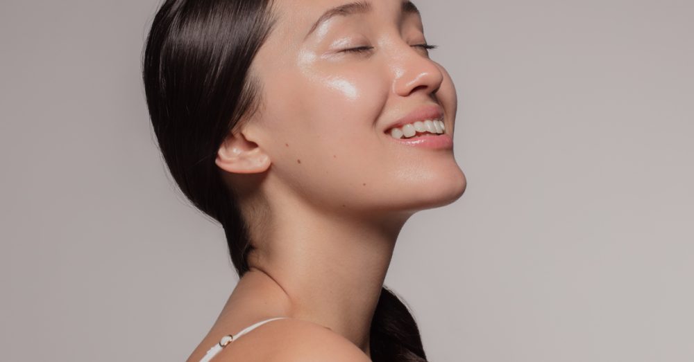 Woman smiling with her eyes closed